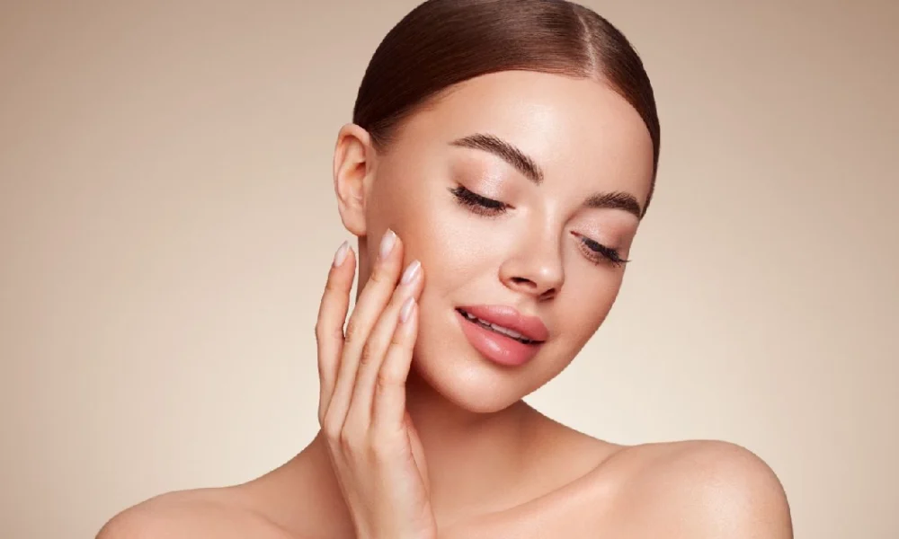 Woman showing radiant skin after Hydrafacial in Carmel IN, showcasing smooth texture, hydration, and a healthy natural glow