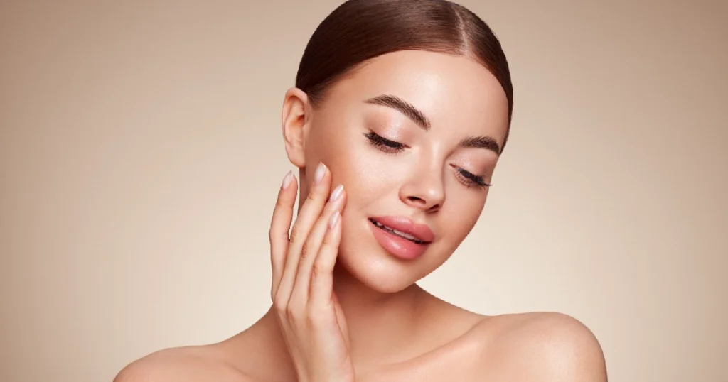 Woman showing radiant skin after Hydrafacial in Carmel IN, showcasing smooth texture, hydration, and a healthy natural glow